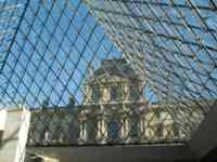 Old Louvre building seen from inside glass pyramid