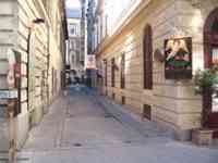 Empty side street with restaurant entrance