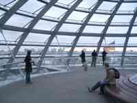 A few people inside metal and glass dome