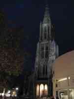 Old church and new city building at night