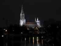 Münster behind Danube illuminated at night