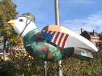 Sparrow sculpture decorated in camouflage uniform with US flag on wings
