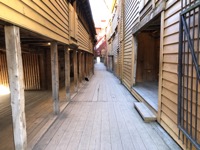 Alley between wood buildings