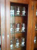 Cabinet containing jars of cacao beans