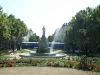 Grandstand behind a statute in a park