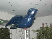 Sculpture of blue sparrow painted with silver stars
