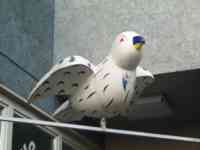 White sparrow sculpture with simple artwork