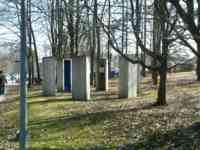 A hexagon of six concrete booths open inward