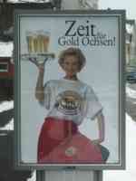 Sidewalk billboard advertising beer