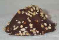 Chocolate pastry, a mound sprinkled with some chopped nuts