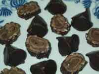 Rounded-triangular chocolates and slices of hazelnut-chocolate roll