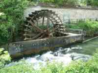 Waterwheel in stream, in spring