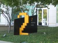 Black sign labeled 2 Infinite Loop with big yellow 2