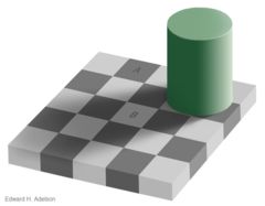 A green column casts a shadow over a checkboard, and two squares that are the same shade appear to be light and dark