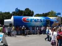 Crest tube truck and line of people waiting to get in and brush their teeth
