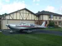 Airplane in front of garage