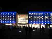 Shopping mall building lit in blue and white