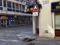 Čumil Man at Work with sign