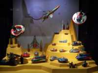 Tin toy space stations, rockets, and flying saucers