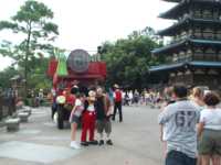 Mickey Mouse character posing with people