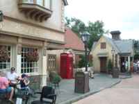 United Kingdom street scene with pub, telephone booth, and fish and chips stand