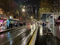 Waiting for a Melbourne tram in the rain