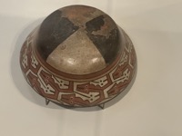 Bowl with interlocking fish and snakes